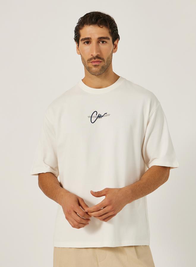 ستايلي تيشيرت أوفر سايز بياقة دائرية وطبعة شعار - Image 1